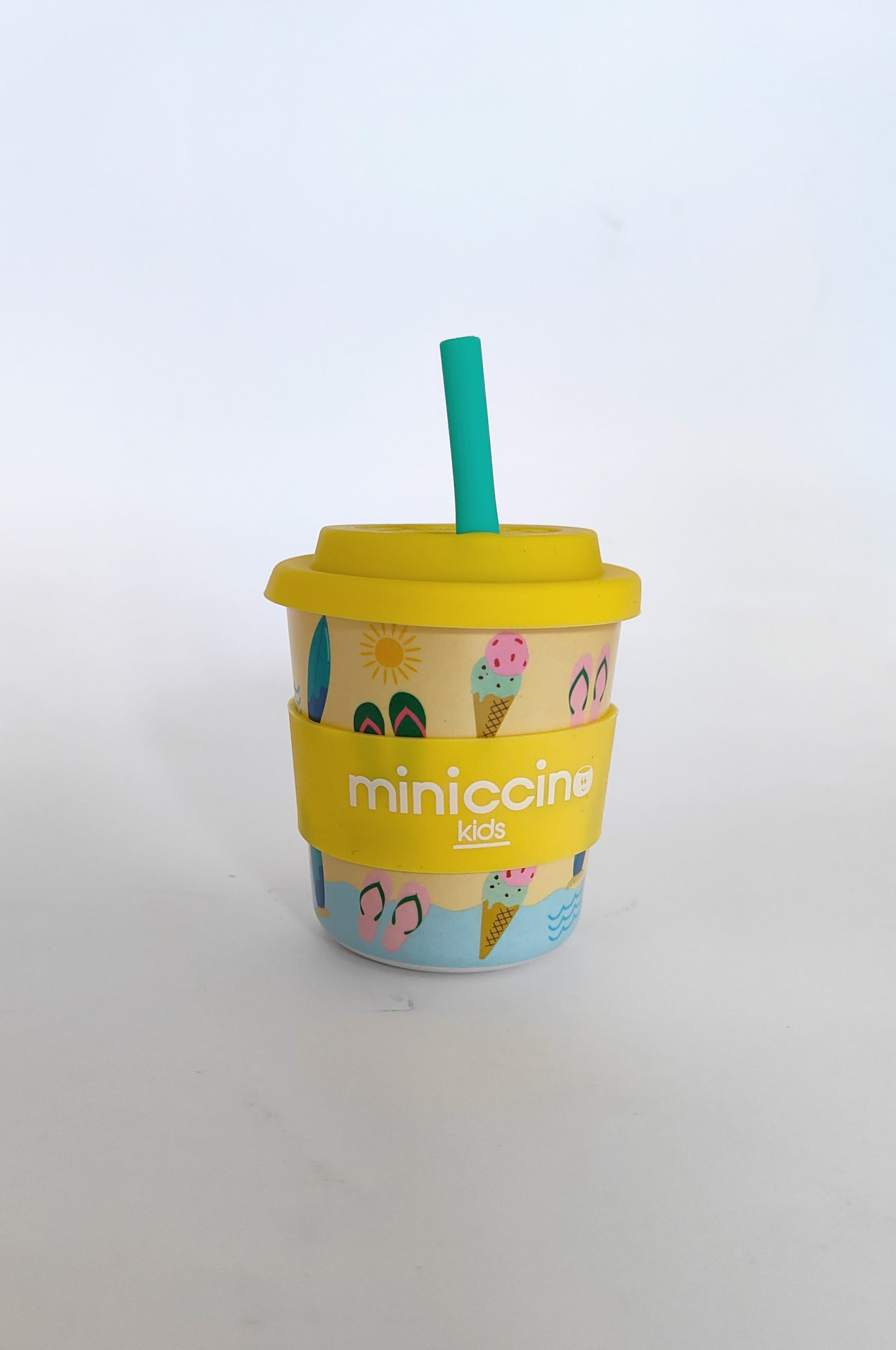 Yellow Summer Vibes Miniccino Kids cup with green straw, featuring fun colourful designs