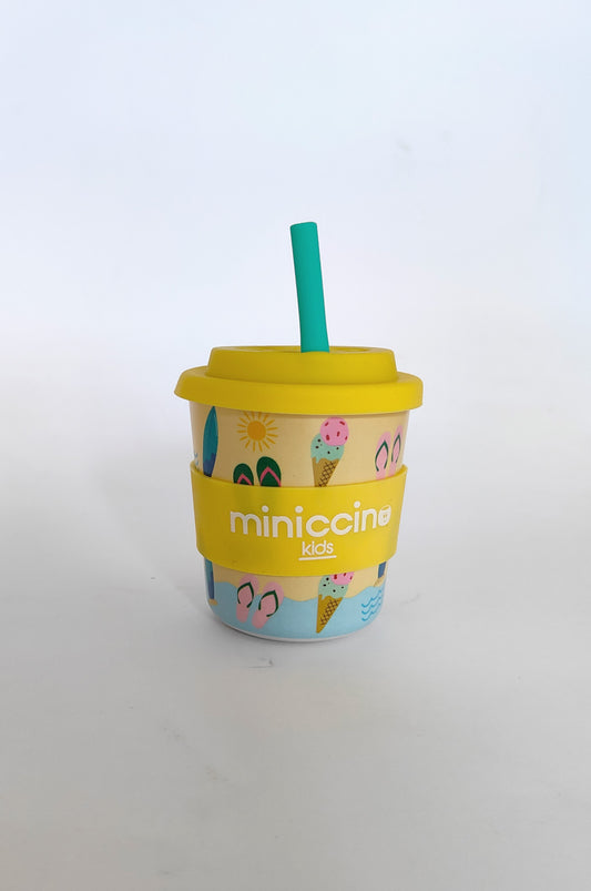 Yellow Summer Vibes Miniccino Kids cup with green straw, featuring fun colourful designs